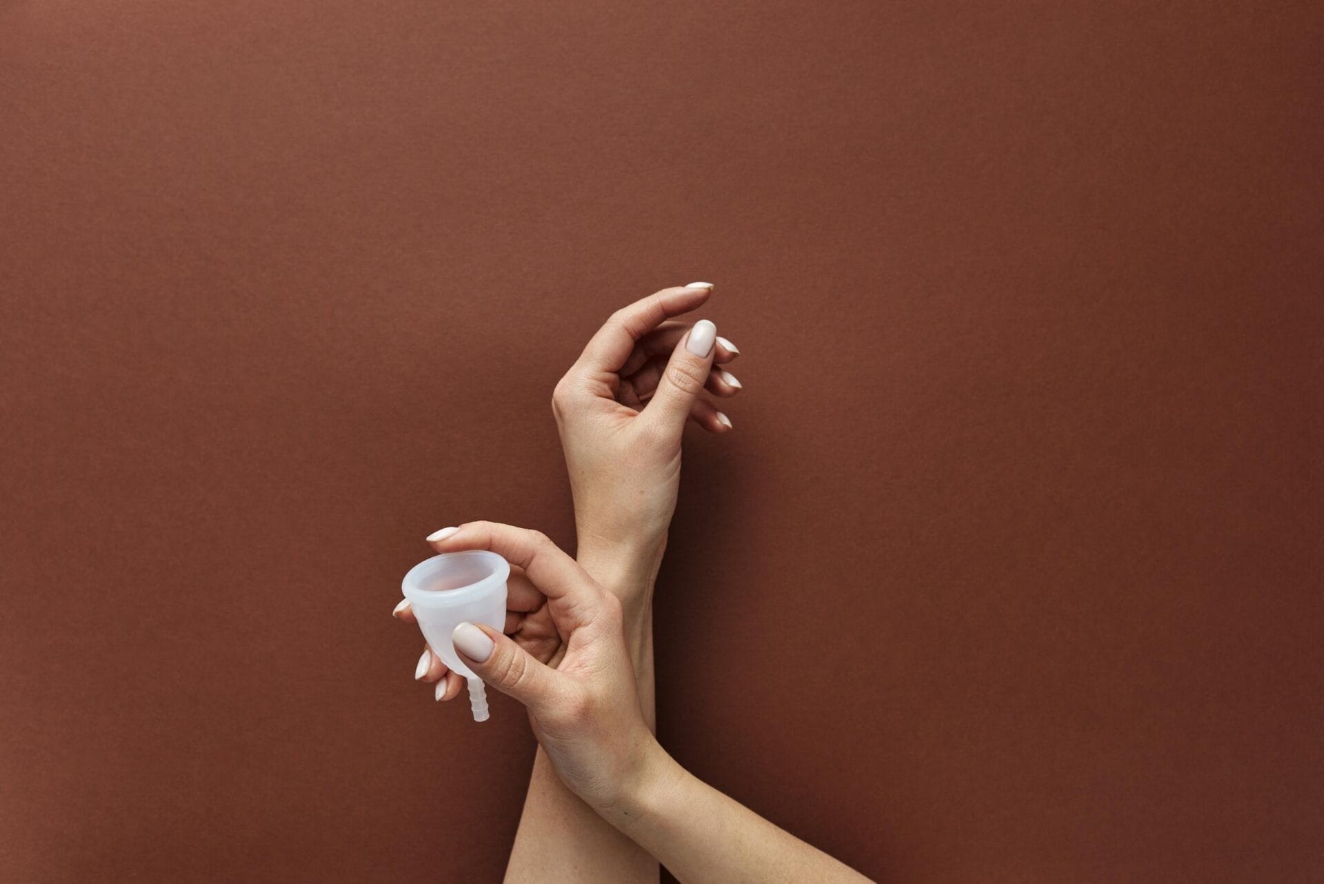 A Person Holding a Menstrual Cup