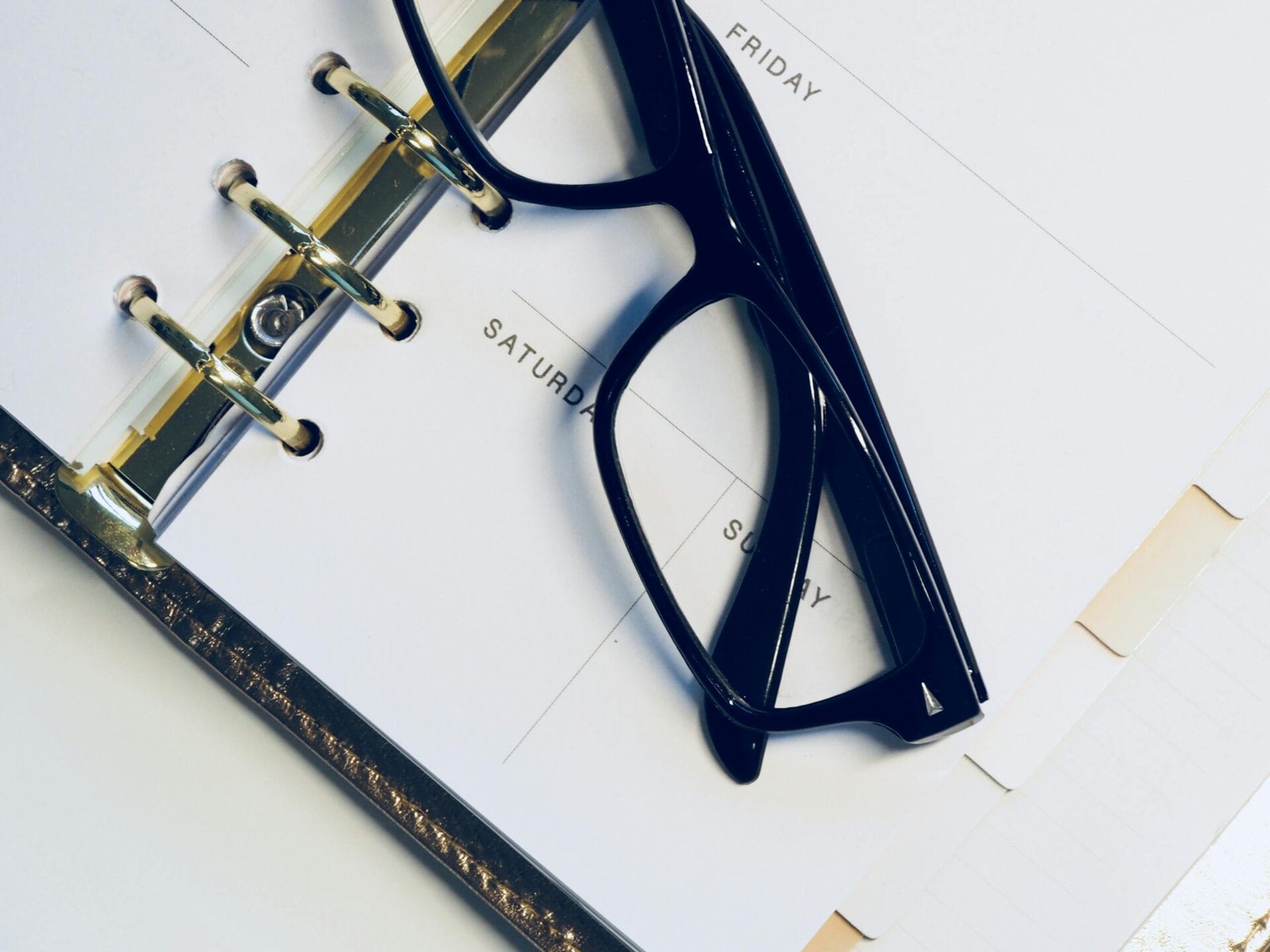 Black Framed Wayfarer Style Eyeglasses on White Surface